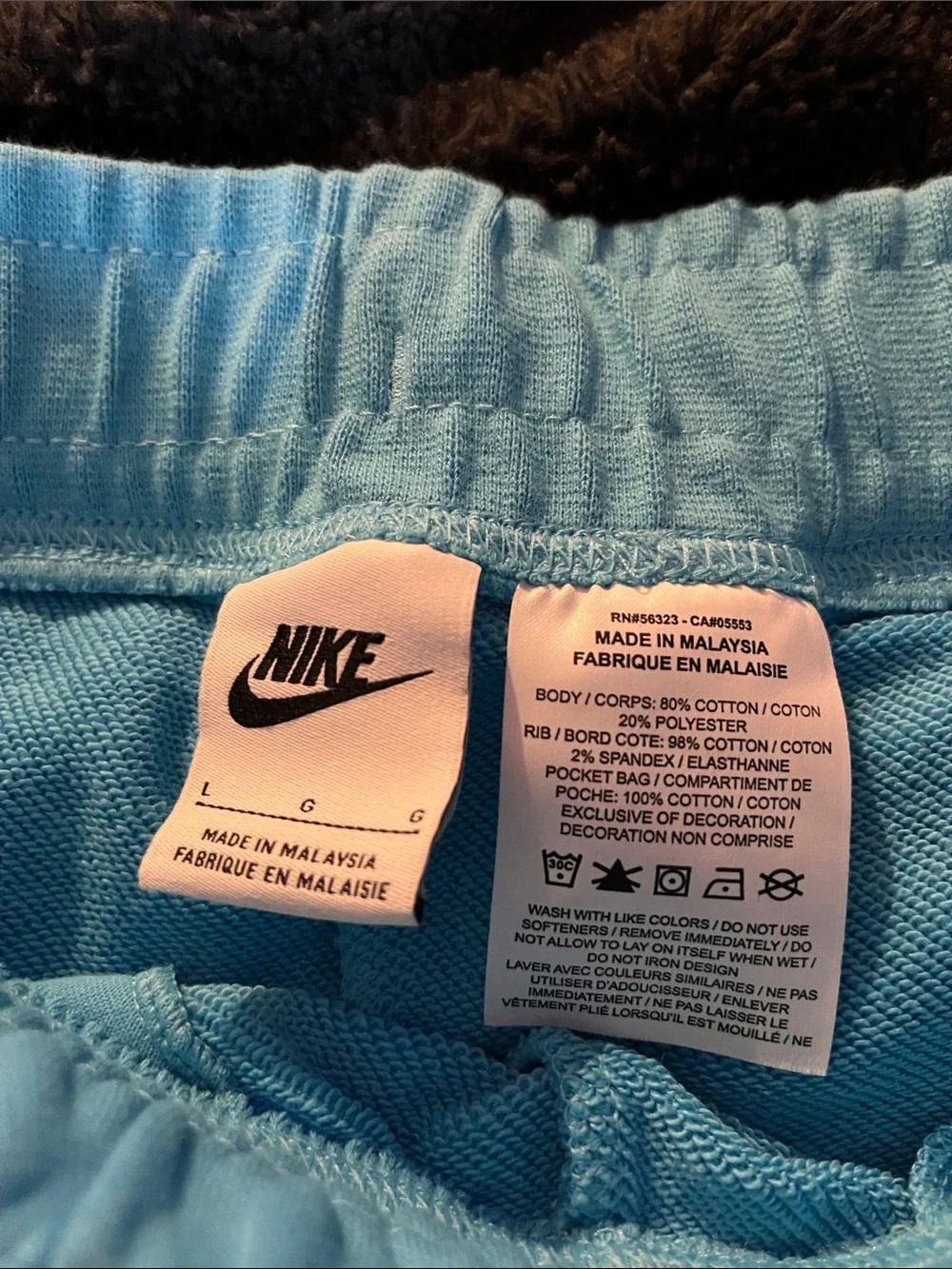 Nike Light Blue Shorts with Pink Swoosh Logo